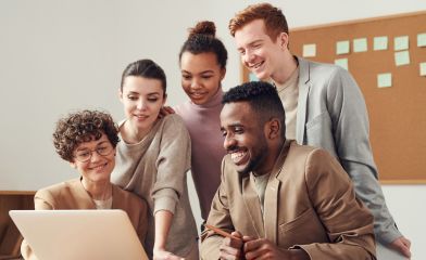 What Coaching Is - Brid Kennedy Coaching - Image of happy team receiving coaching